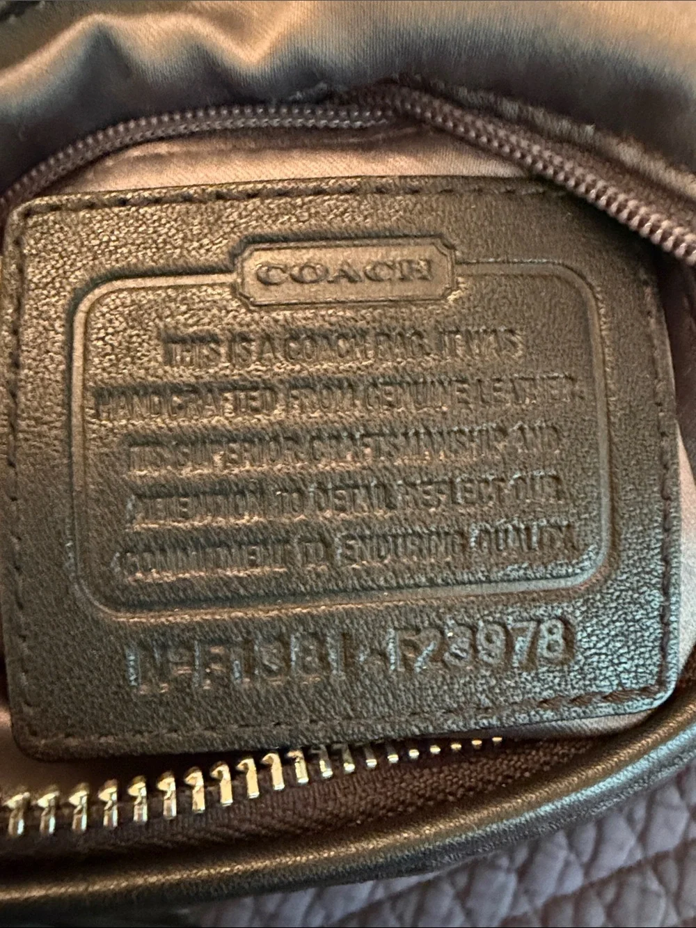 Coach Vintage Y2K Daisy Black Leather Shoulder Bag with Front Zip and Logo.